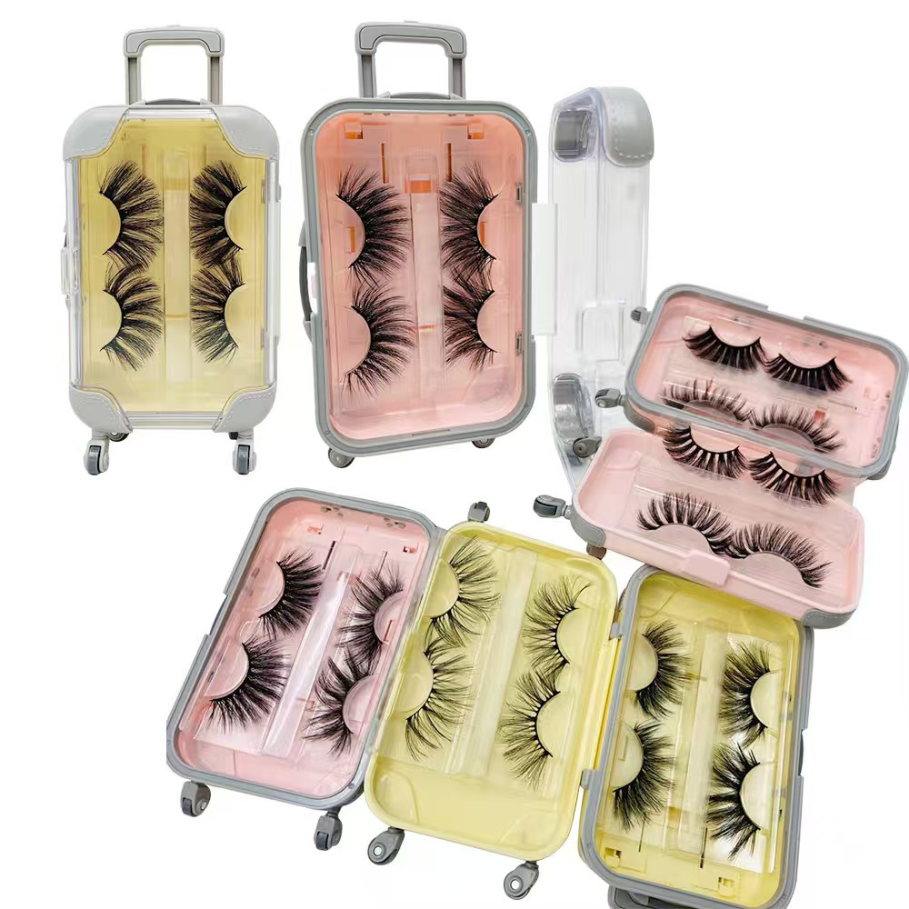 Luggage suitcase eyelash packaging creative design rolling wheels handle false lashes pink yellow travel theme containers